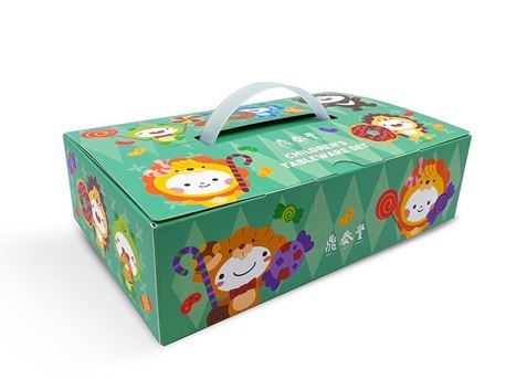 Green children's cutlery set with spoon, fork, and chopsticks